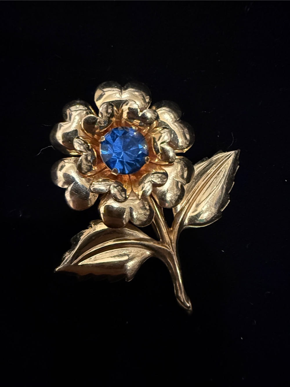 Vintage-Inspired Gold Flower Brooch with Blue Center Stone